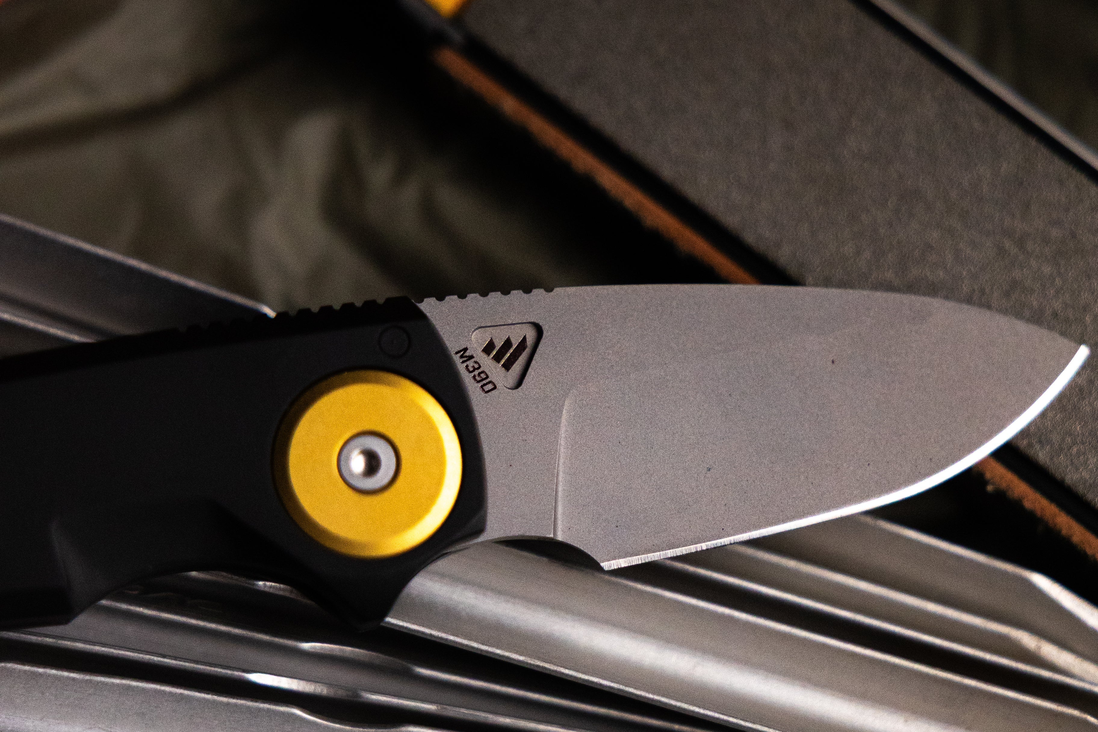 Close up of M390 steel blade on the Work Sharp RMX Compact Drop Point knife.