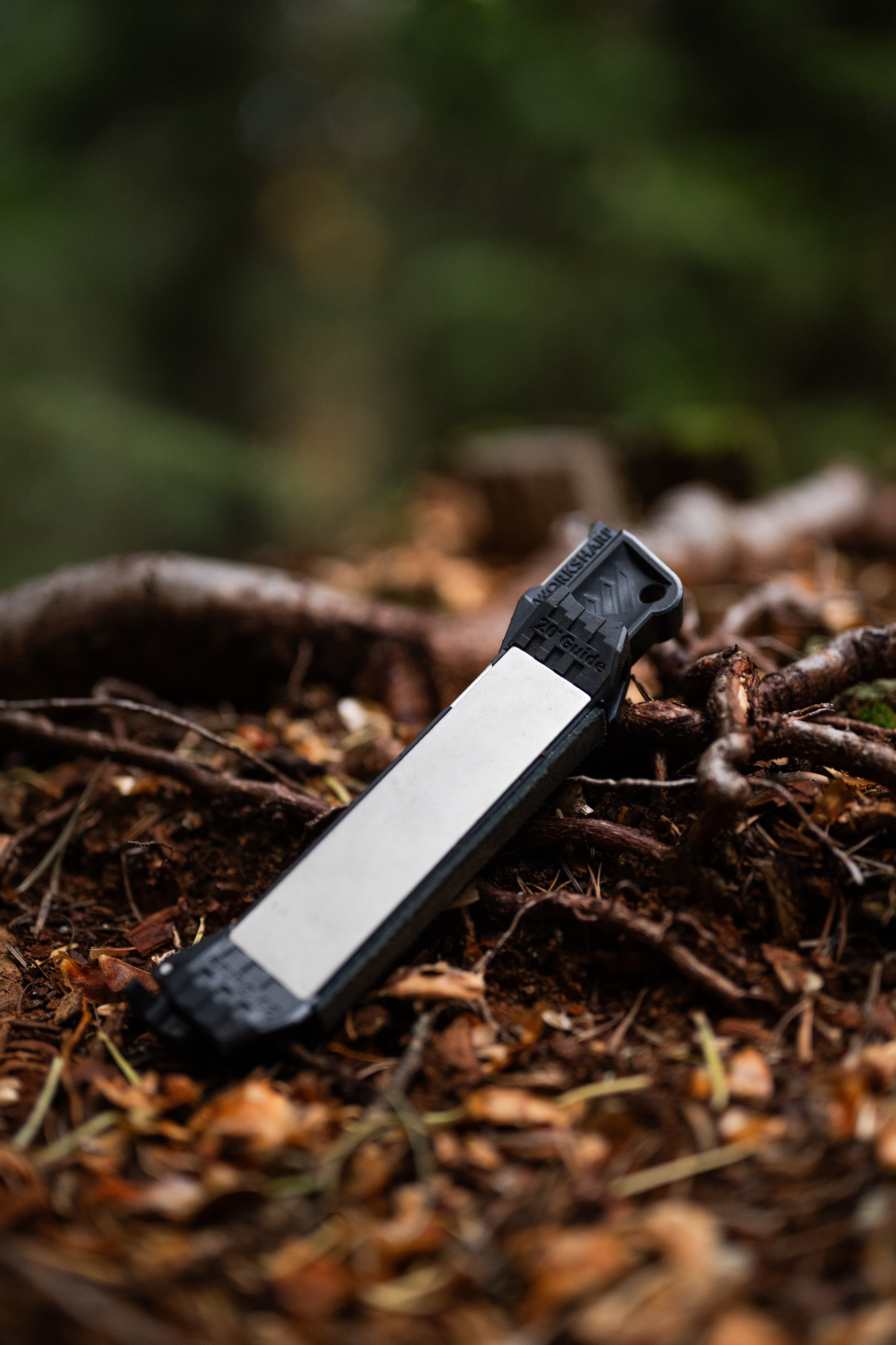 Black and white Guided Field Sharpener Blackout | Reserve Series on a forest floor
