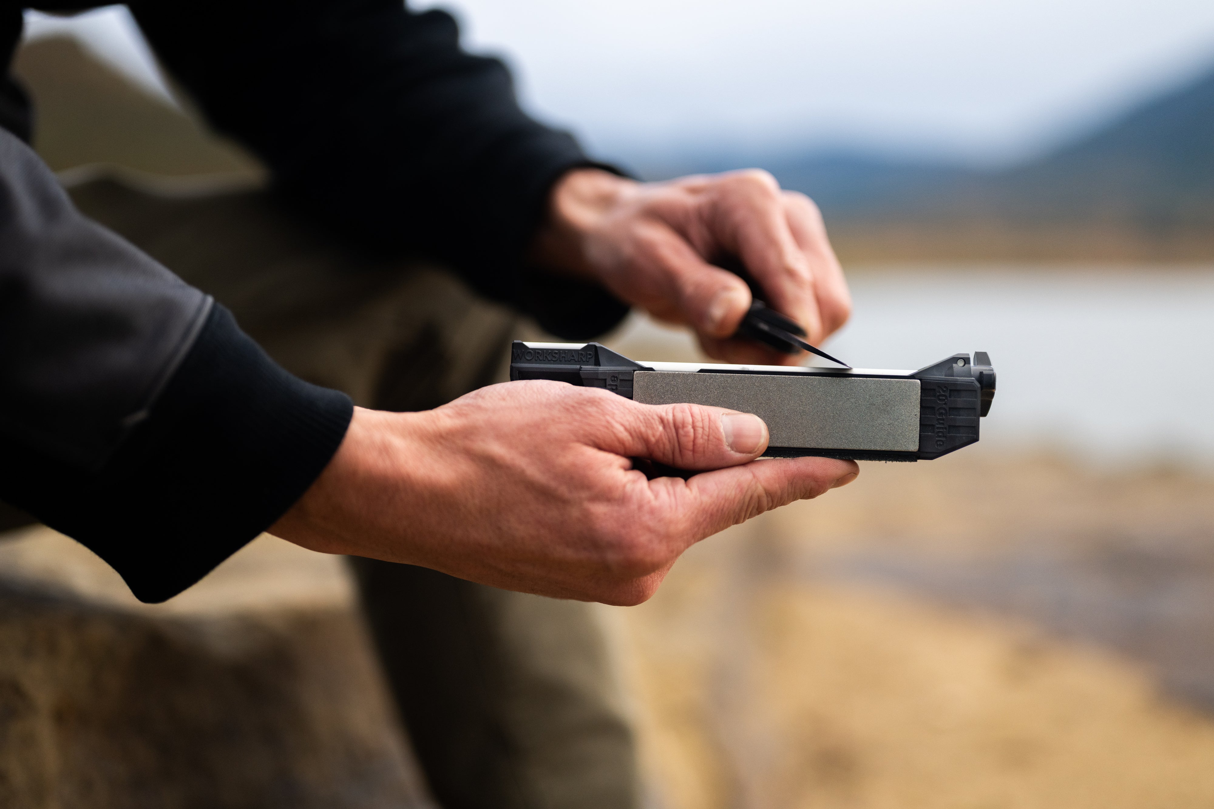 Guided Field Sharpener Blackout | Reserve Series  with a blurred natural background